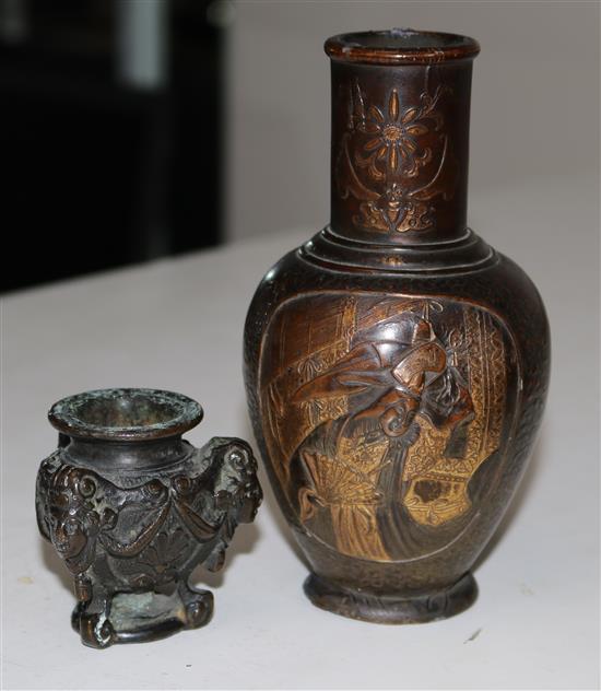 A bronze figured candlestick and a Japanese vase